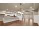 Open kitchen area with granite countertops, stainless steel appliances, and hardwood floors at 2845 Echols Road Rd, Cumming, GA 30041
