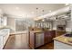 Gourmet kitchen with island, granite countertops, hardwood floors, and built-in appliances, ideal for cooking and entertaining at 2845 Echols Road Rd, Cumming, GA 30041