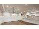 Kitchen area with an island, hardwood floors, and white cabinets at 2845 Echols Road Rd, Cumming, GA 30041