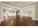 Beautiful hardwood floors and large columns in an open floor plan with staircase in view at 2845 Echols Road Rd, Cumming, GA 30041