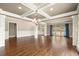Spacious room with beautiful hardwood floors, coffered ceilings, and large windows that fill the space with natural light at 2845 Echols Road Rd, Cumming, GA 30041