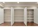 Pantry featuring shelving units with double doors for plenty of storage at 2845 Echols Road Rd, Cumming, GA 30041