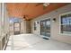 View of a screened in porch with ceiling fans and tan walls and ceiling at 2845 Echols Road Rd, Cumming, GA 30041