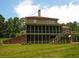 Expansive backyard featuring a screened-in porch and deck, perfect for outdoor entertaining and relaxation at 2845 Echols Road Rd, Cumming, GA 30041