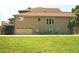 Back of home with a 2-car garage with extra storage, deck, and ample parking space at 2845 Echols Road Rd, Cumming, GA 30041