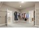 Spacious walk-in closet with ample storage and organization options, and access to the en-suite bathroom at 2845 Echols Road Rd, Cumming, GA 30041