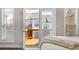 Bedroom view of the exterior balcony through large glass doors and windows at 4358 Parkside Pl, Atlanta, GA 30342