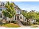 Charming townhome with brick facade, lush landscaping, and welcoming front entrance at 4358 Parkside Pl, Atlanta, GA 30342