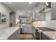 Open kitchen with stainless appliances, granite counters, and seamlessly connected to the dining area at 4358 Parkside Pl, Atlanta, GA 30342
