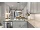 Chic kitchen with stainless steel appliances, granite counters, opening to the dining area at 4358 Parkside Pl, Atlanta, GA 30342
