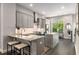 Stylish kitchen featuring gray cabinets, stainless steel appliances, and granite countertops at 4358 Parkside Pl, Atlanta, GA 30342