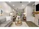 Open-concept living room with dining area showcasing modern decor and hardwood floors at 4358 Parkside Pl, Atlanta, GA 30342