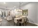 Cozy living area with wood floors adjacent to dining area at 4358 Parkside Pl, Atlanta, GA 30342