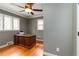 Neutral bedroom features hardwood floors, crown molding, and natural light from the double windows at 2628 Tanglewood Rd, Decatur, GA 30033