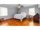 Bedroom featuring hardwood floors, neutral walls, and dual windows at 2628 Tanglewood Rd, Decatur, GA 30033