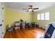 Bright bedroom with hardwood floors, a ceiling fan, and a large window offering ample natural light at 2628 Tanglewood Rd, Decatur, GA 30033