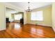 Open concept dining room with hardwood floors, chandelier, and easy access to other rooms at 2628 Tanglewood Rd, Decatur, GA 30033