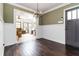 Charming entryway with hardwood floors, wainscoting detail, and natural light from adjoining rooms at 2628 Tanglewood Rd, Decatur, GA 30033