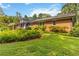Exterior of the home with a brick facade and a wooden deck in the back at 2628 Tanglewood Rd, Decatur, GA 30033