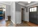 Hallway with paneled walls leads to an exterior door at 2628 Tanglewood Rd, Decatur, GA 30033
