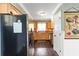 Efficient kitchen features stainless steel appliances, wood cabinets, and a view to the backyard at 2628 Tanglewood Rd, Decatur, GA 30033