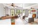 Bright living room with slate-look tile floor, neutral walls, and multiple windows at 2628 Tanglewood Rd, Decatur, GA 30033