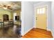 Bright living room with hardwood floors, yellow door, and open view to another area at 2628 Tanglewood Rd, Decatur, GA 30033