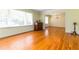Inviting living room featuring hardwood floors, large windows, and classic trim detail at 2628 Tanglewood Rd, Decatur, GA 30033