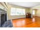 Bright living room with fireplace, large window with natural light, and hardwood floors at 2628 Tanglewood Rd, Decatur, GA 30033