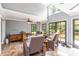 Neutral living room with slate-look tile floor and many windows providing outdoor views at 2628 Tanglewood Rd, Decatur, GA 30033