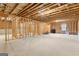 Spacious unfinished basement ready to be customized with exposed beams, concrete floors, and framed walls at 113 Overlook Ridge Way Way, Canton, GA 30114