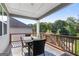 The deck has an outdoor dining table, four chairs, and a great view of the neighborhood at 113 Overlook Ridge Way Way, Canton, GA 30114