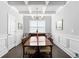 Elegant dining room with coffered ceilings, paneled walls, and a statement chandelier at 113 Overlook Ridge Way Way, Canton, GA 30114