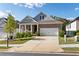 Lovely home featuring a brick facade, well-manicured lawn, and a two-car garage at 113 Overlook Ridge Way Way, Canton, GA 30114