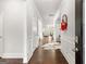 Elegant hallway featuring hardwood floors, white trim, and decorative wall accents at 113 Overlook Ridge Way Way, Canton, GA 30114