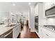 Bright kitchen with stainless steel appliances, white cabinetry, granite countertops, and wood floors at 113 Overlook Ridge Way Way, Canton, GA 30114