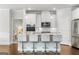 Stylish kitchen with white cabinets, granite countertops, and a breakfast bar at 113 Overlook Ridge Way Way, Canton, GA 30114