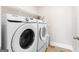 This spacious laundry room comes equipped with a large Samsung washing machine and dryer at 113 Overlook Ridge Way Way, Canton, GA 30114