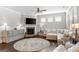 Cozy living room with a stone fireplace, hardwood floors, and ample natural light at 113 Overlook Ridge Way Way, Canton, GA 30114
