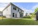 Spacious backyard with lawn, patio, and iron fence at 129 Academy Ln, Canton, GA 30114