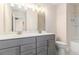 Bathroom featuring double sinks, gray vanity, and tile flooring at 129 Academy Ln, Canton, GA 30114