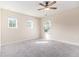 Bedroom with natural light, plush carpet, and ceiling fan at 129 Academy Ln, Canton, GA 30114