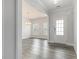 Bright entryway featuring stylish wood flooring and a modern light fixture at 129 Academy Ln, Canton, GA 30114