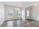 Beautiful entryway featuring a chandelier, stylish floors, and bright natural light at 129 Academy Ln, Canton, GA 30114