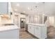 Bright kitchen with white cabinets, stainless steel appliances, and a large island at 129 Academy Ln, Canton, GA 30114