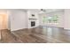 A cozy living area with fireplace offering a view of the backyard at 129 Academy Ln, Canton, GA 30114