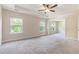 Spacious main bedroom with tray ceiling, neutral walls, and plush carpeting providing a calm retreat at 129 Academy Ln, Canton, GA 30114