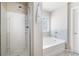 Bright bathroom boasts a new shower and garden tub that provides an at-home spa experience at 207 Cross Rd, Acworth, GA 30102