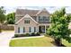 Charming home with great curb appeal, manicured lawn, and traditional design at 207 Cross Rd, Acworth, GA 30102