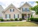 Beautiful home with well-kept lawn and dark shutters at 207 Cross Rd, Acworth, GA 30102